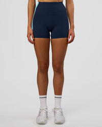 Woman wearing Revitalise Ultra High-Rise 4" Short - Future Navy-Multi | Model:Evie | Size:S