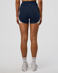 Woman wearing Revitalise Ultra High-Rise 4" Short - Future Navy-Multi | Model:Evie | Size:S