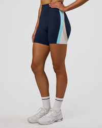 Woman wearing Revitalise Ultra High-Rise 6" Short - Future Navy-Multi | Model:Evie | Size:S