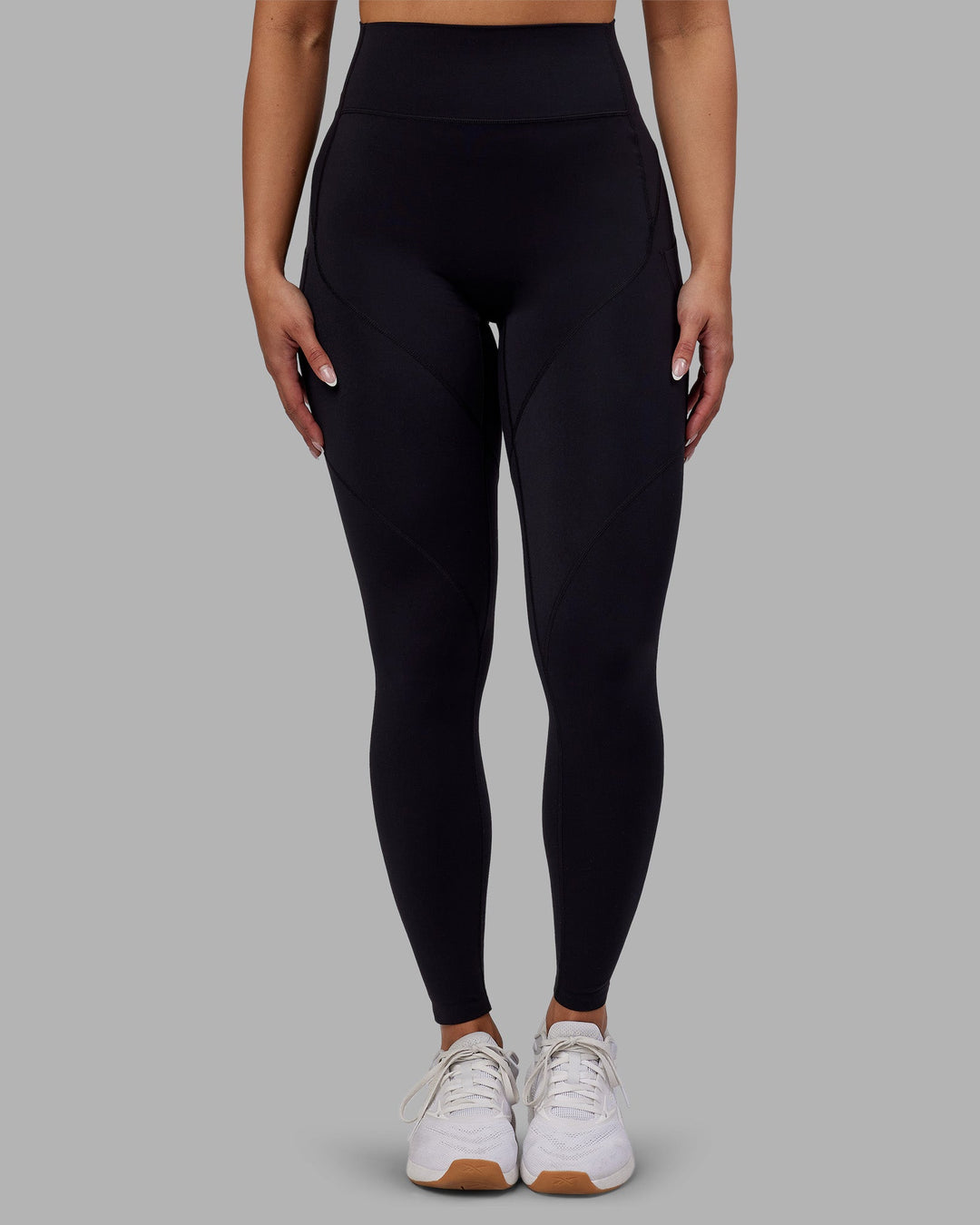 Woman wearing Rhythm Elixir Ultra High-Rise Full Length Legging Pockets - Black | Model:Ayla | Size:S