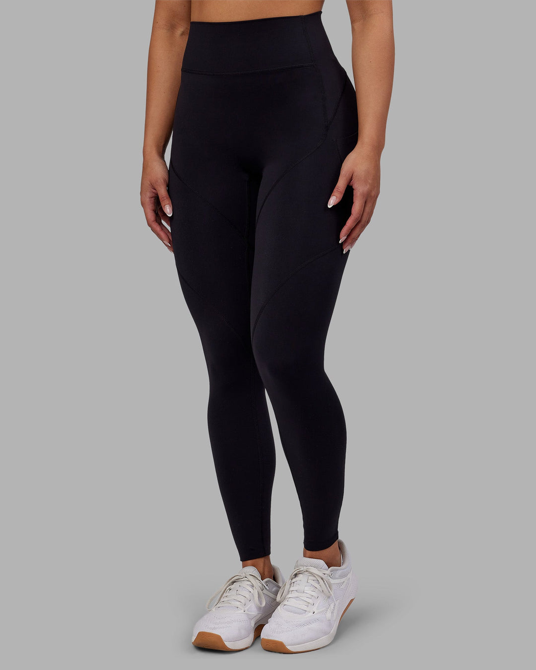Woman wearing Rhythm Elixir Ultra High-Rise Full Length Legging Pockets - Black | Model:Ayla | Size:S