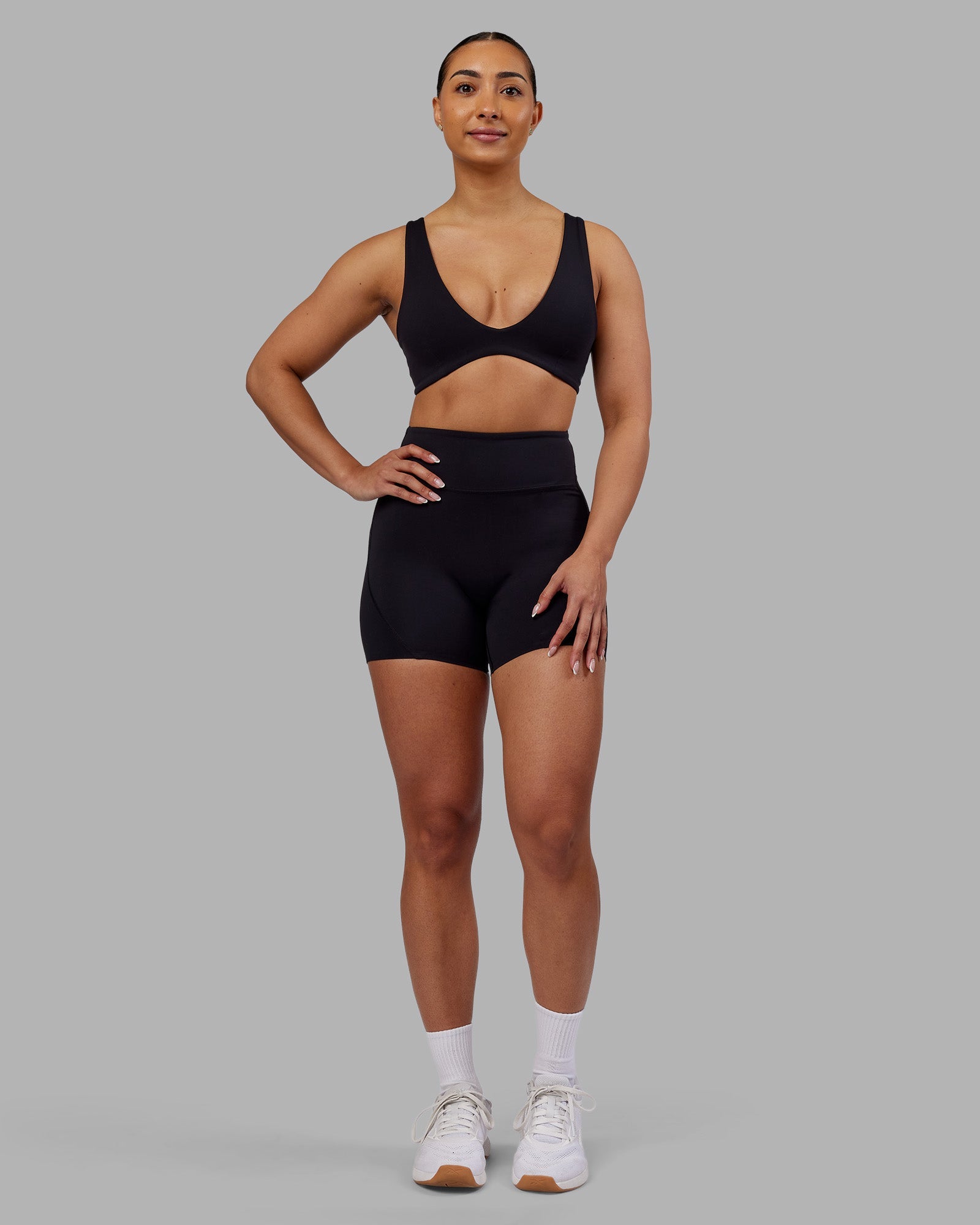Woman wearing Rhythm Elixir Ultra High-Rise 4" Short - Black | Model:Ayla | Size:S