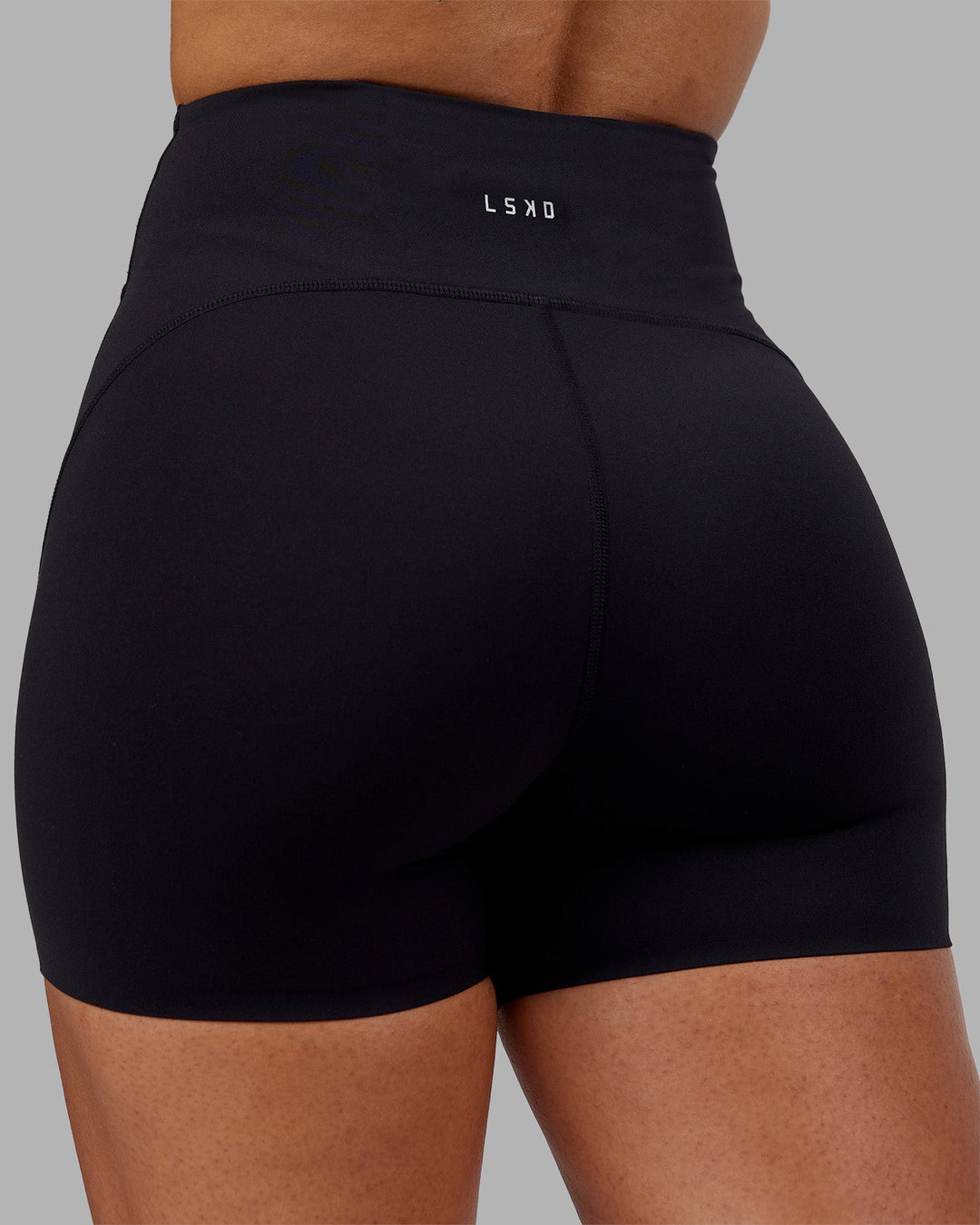 Woman wearing Rhythm Elixir Ultra High-Rise 4&quot; Short - Black | Model:Ayla | Size:S
