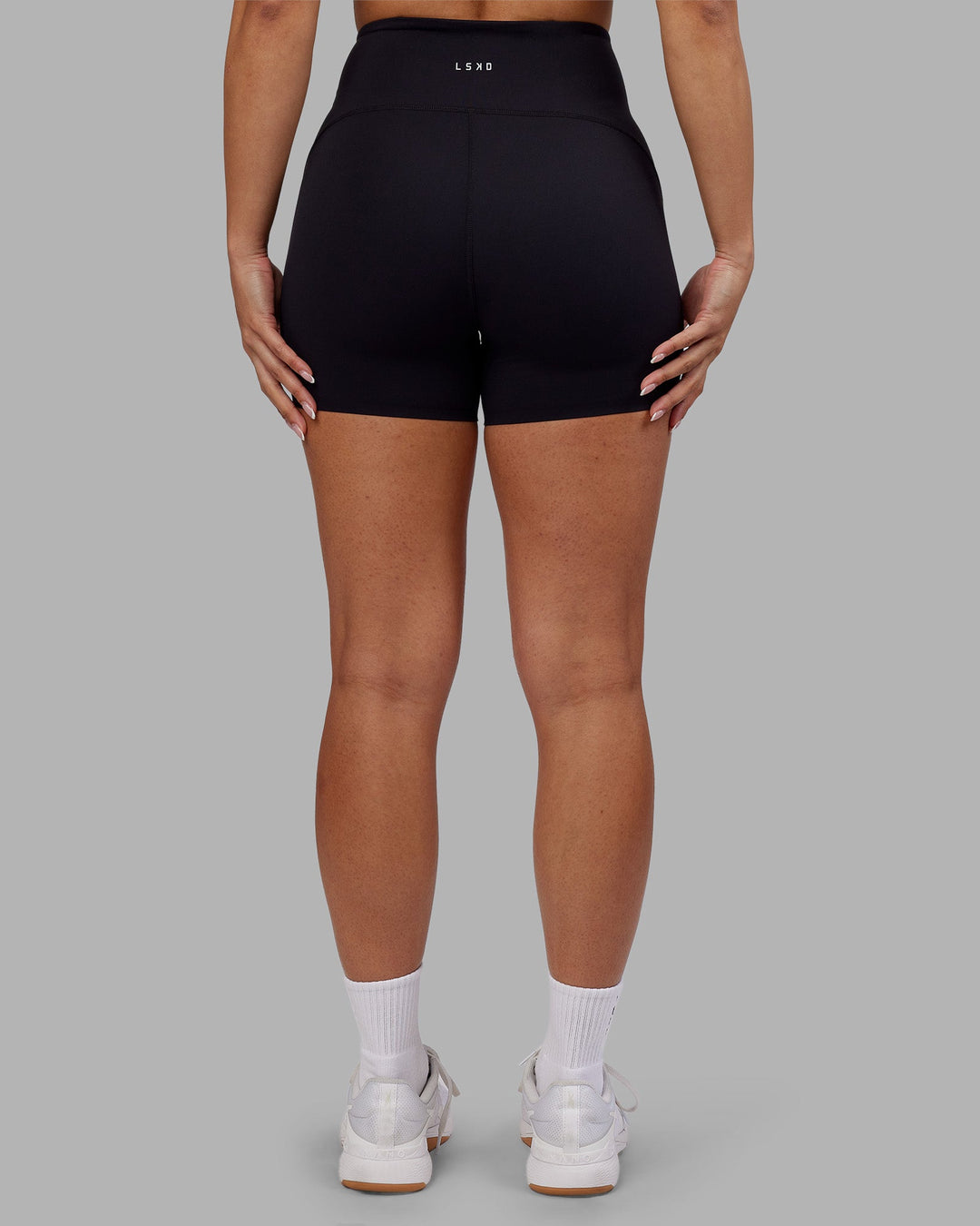 Woman wearing Rhythm Elixir Ultra High-Rise 4&quot; Short - Black | Model:Ayla | Size:S