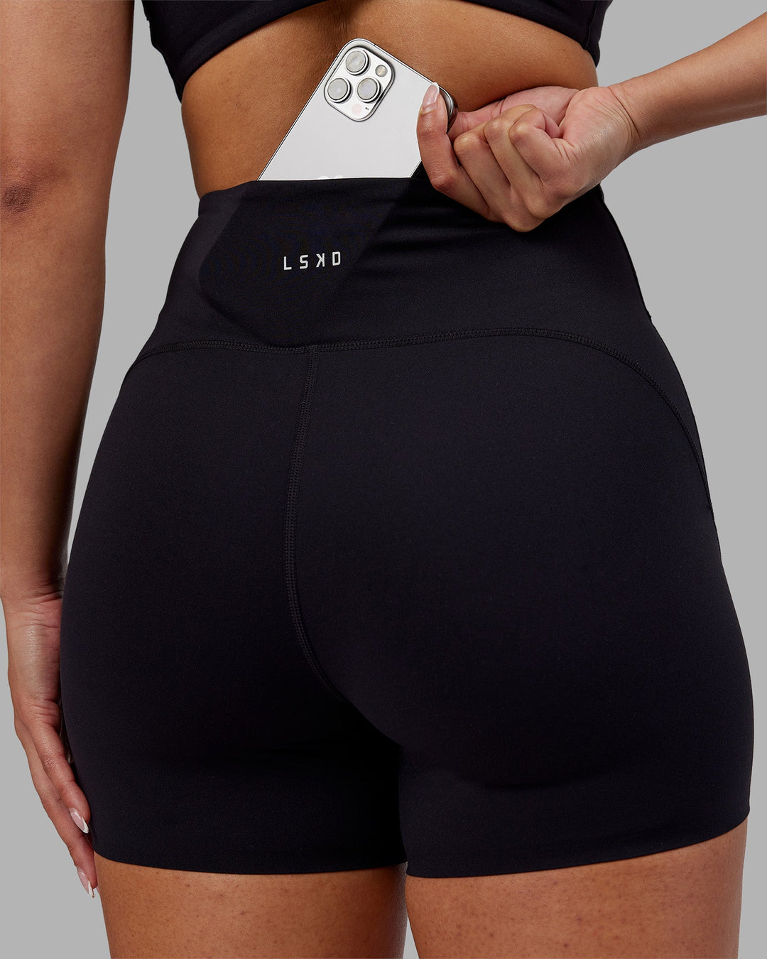 Woman wearing Rhythm Elixir Ultra High-Rise 4&quot; Short - Black | Model:Ayla | Size:S