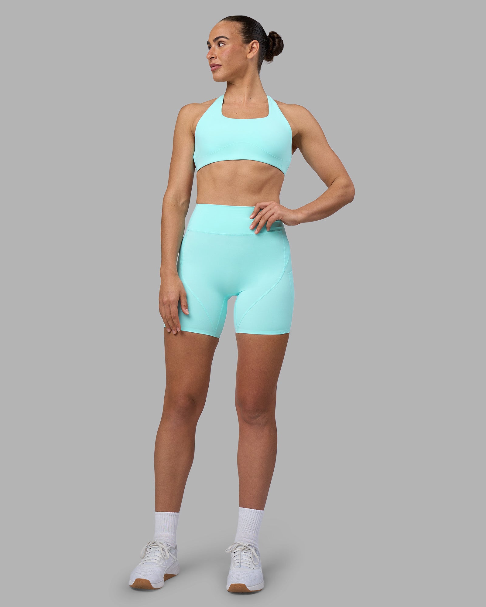 Woman wearing Rhythm Elixir Ultra High-Rise 6" Short Pockets - Island Paradise | Model:Sophie | Size:S
