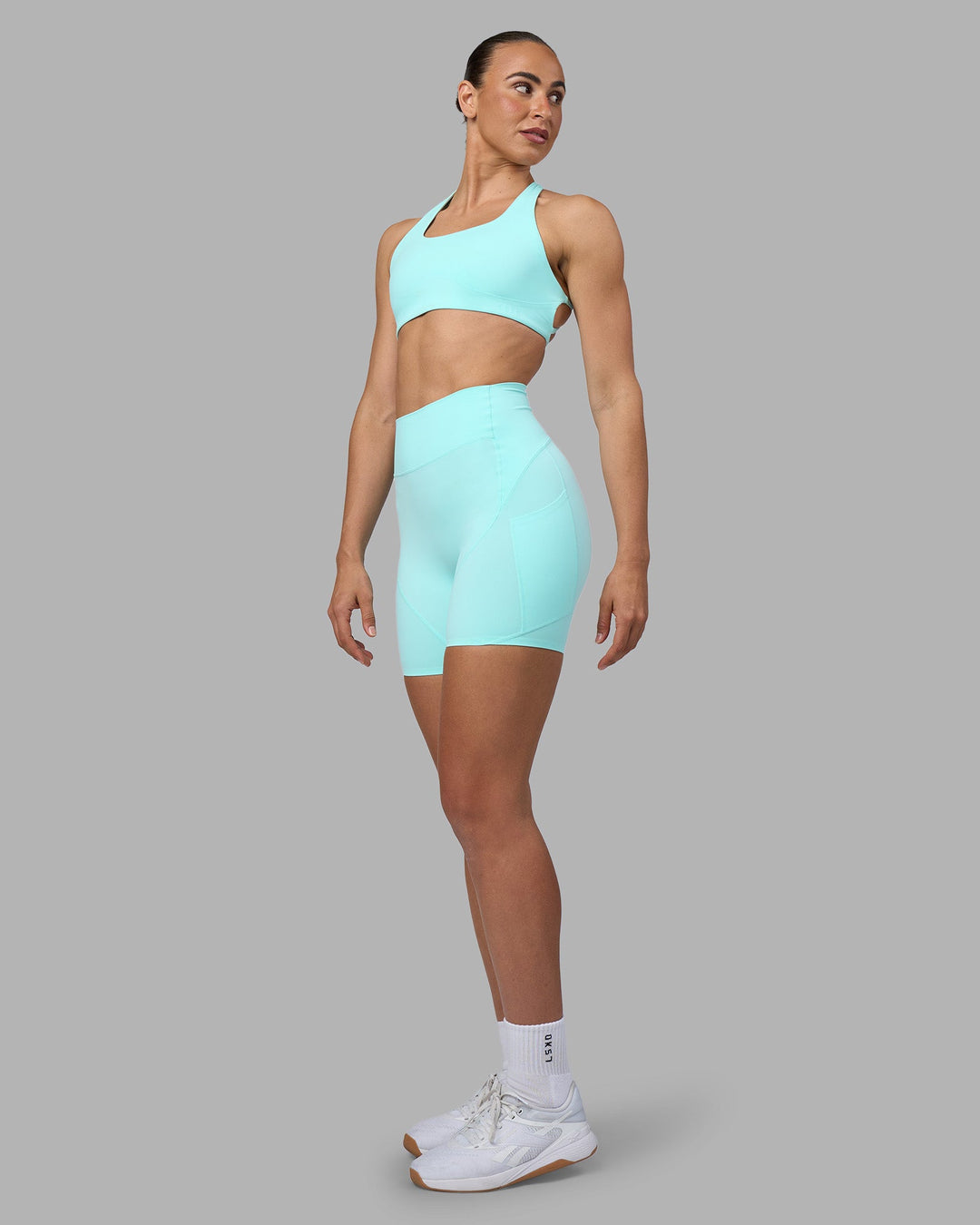 Woman wearing Rhythm Elixir Ultra High-Rise 6&quot; Short Pockets - Island Paradise | Model:Sophie | Size:S