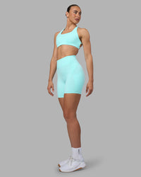 Woman wearing Rhythm Elixir Ultra High-Rise 6" Short Pockets - Island Paradise | Model:Sophie | Size:S