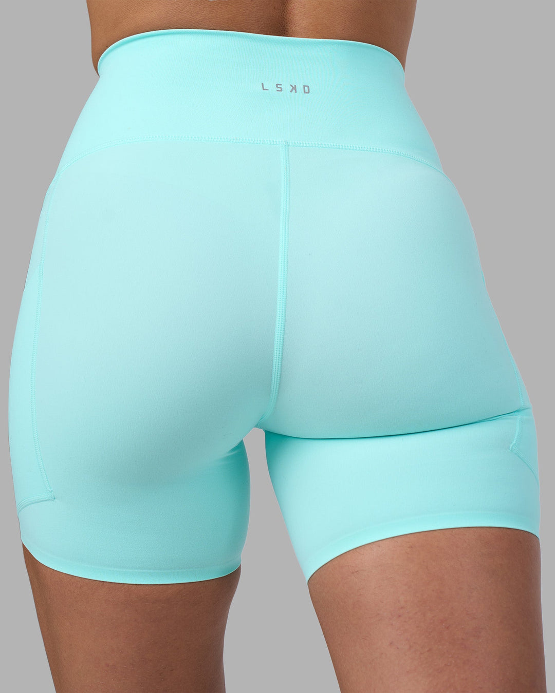 Woman wearing Rhythm Elixir Ultra High-Rise 6&quot; Short Pockets - Island Paradise | Model:Sophie | Size:S