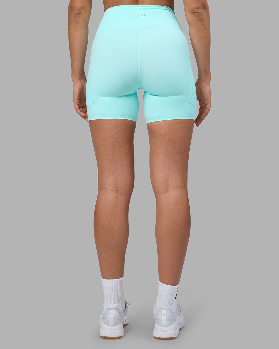 Woman wearing Rhythm Elixir Ultra High-Rise 6&quot; Short Pockets - Island Paradise | Model:Sophie | Size:S