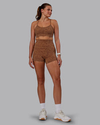 Woman wearing Rush Sports Bra - Caramel-Agile Print | Model:Phoebe | Size:S