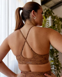Woman wearing Rush Sports Bra - Caramel-Agile Print | Model:Chantelle | Size: