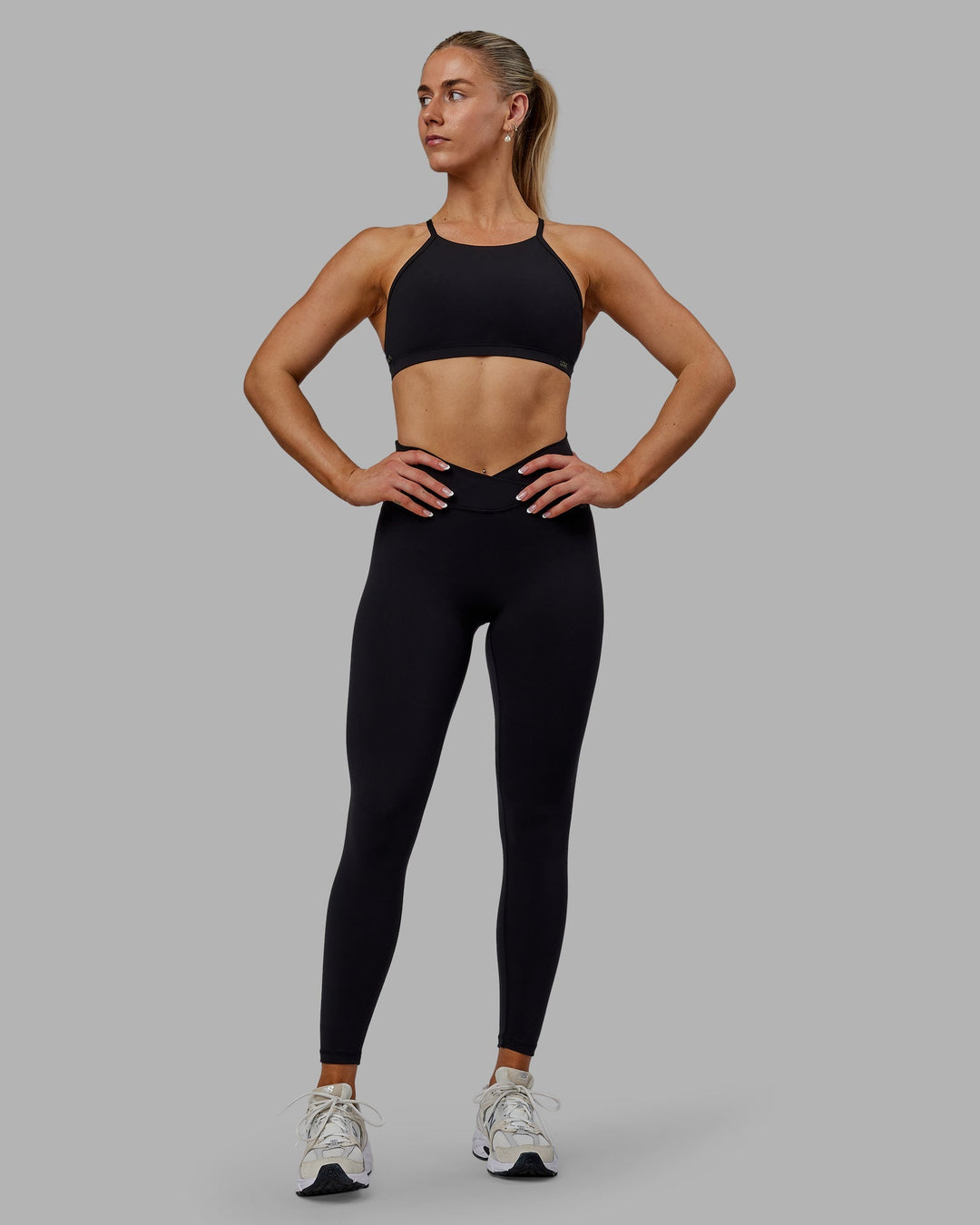 Woman wearing Sara Strike Cross Over Waist Full Length Leggings - Black