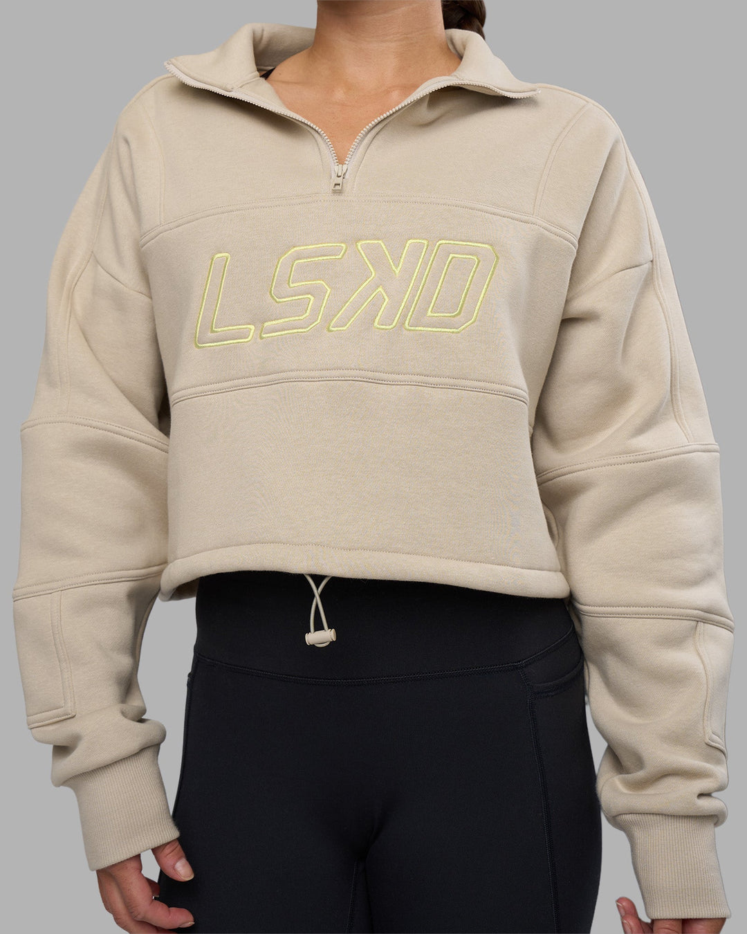 Woman wearing Slam Quarter Zip Sweater - Shale Beige-Lime Glo | Model:Hannah | Size:S
