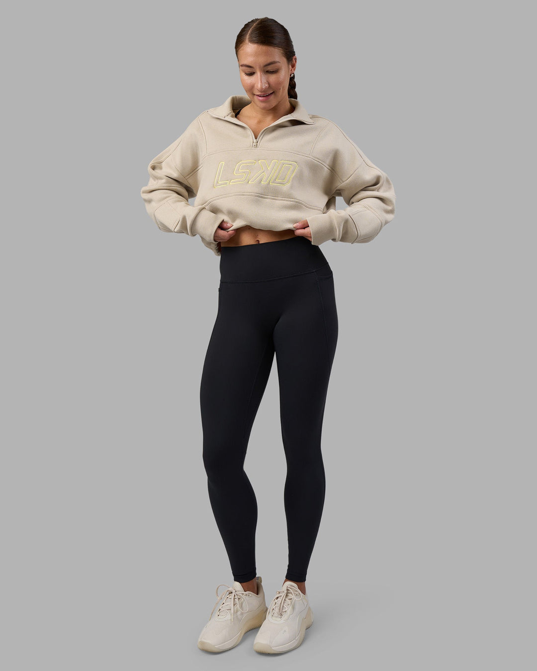 Woman wearing Slam Quarter Zip Sweater - Shale Beige-Lime Glo | Model:Hannah | Size:S