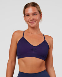 Woman wearing Spark Seamless Ribbed Sports Bra - Future Navy-Ultra Fuchsia | Model:Amity | Size:S | Thumbnail Index: 0