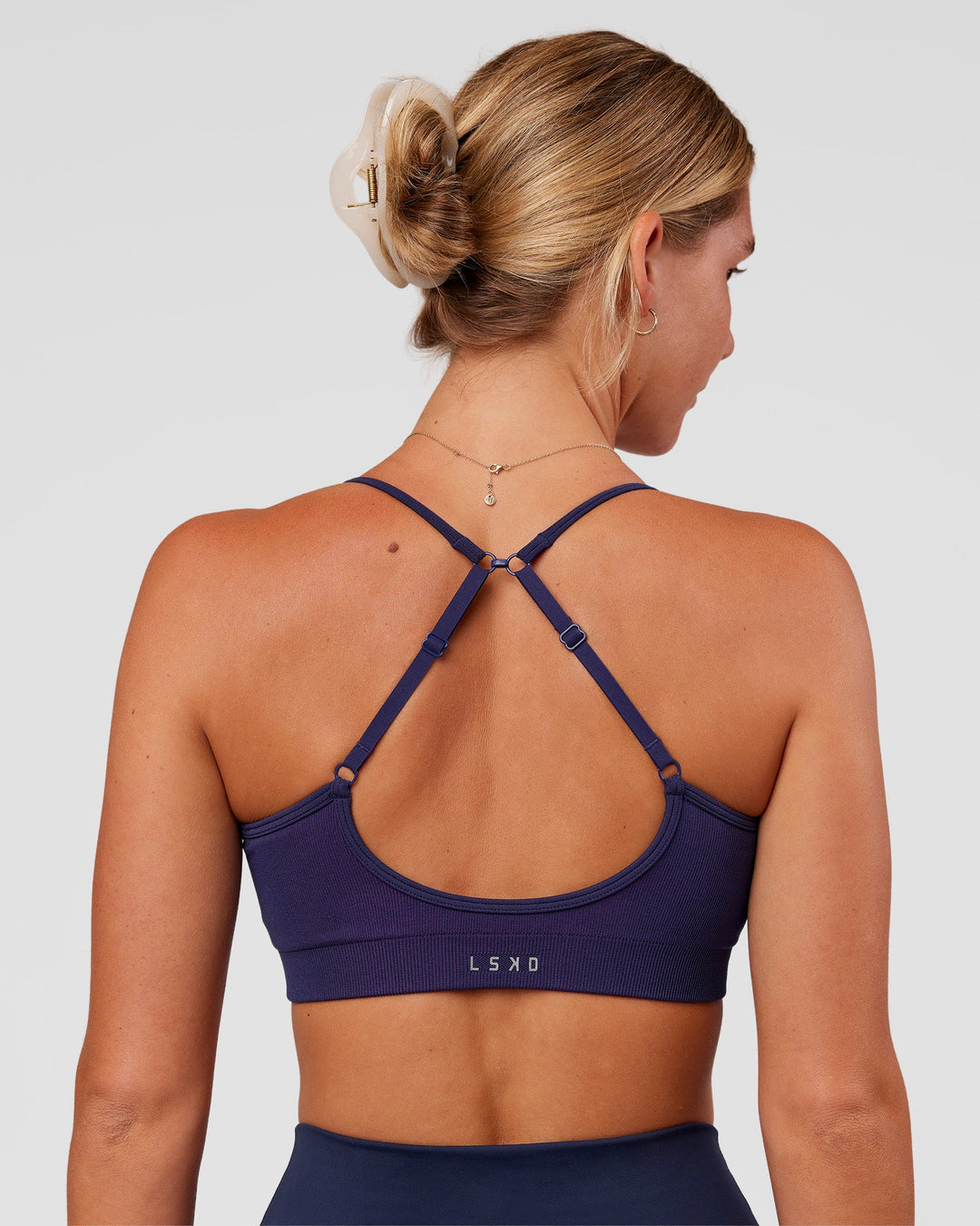 Woman wearing Spark Seamless Ribbed Sports Bra - Future Navy-Ultra Fuchsia | Model:Amity | Size:S - view 2