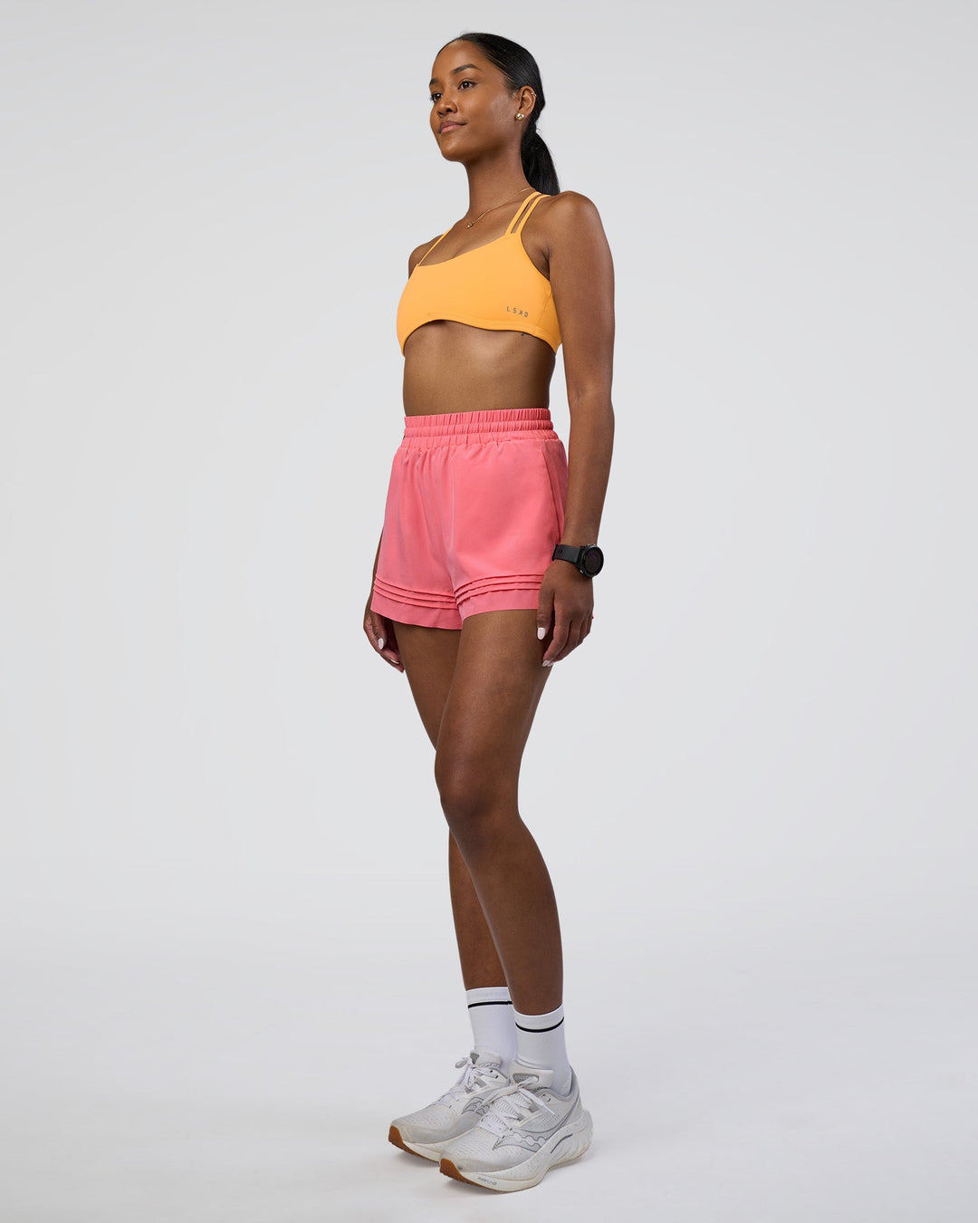 Woman wearing Sport Short 2.5&quot; - Pink Lemonade | Model:Rica | Size:S