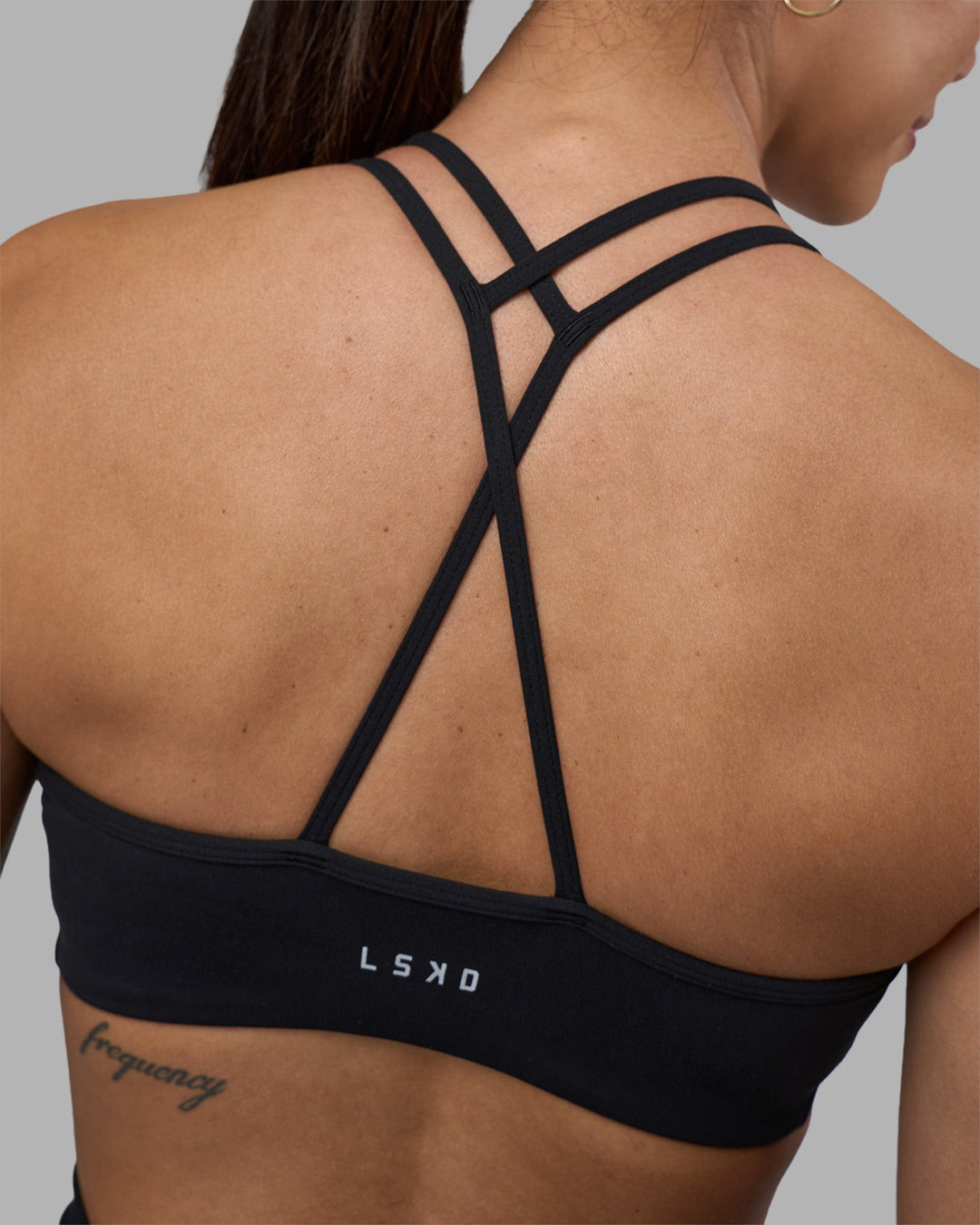 Woman wearing Stamina Pulse Sports Bra - Black | Model:Rhiley | Size:S