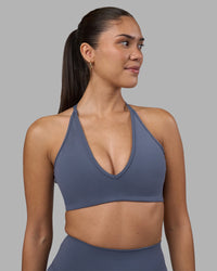 Woman wearing Stamina Pulse Sports Bra - Night Shadow | Model:Rhiley | Size:S | Thumbnail Index: 0