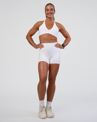 Woman wearing Stamina Pulse Sports Bra - White | Model:Sav | Size:S