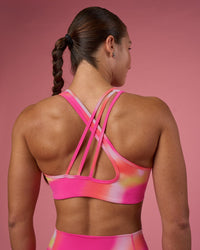 Woman wearing Stamina Rise Sports Bra - Pink Glow Print | Model:Hannah | Size:S