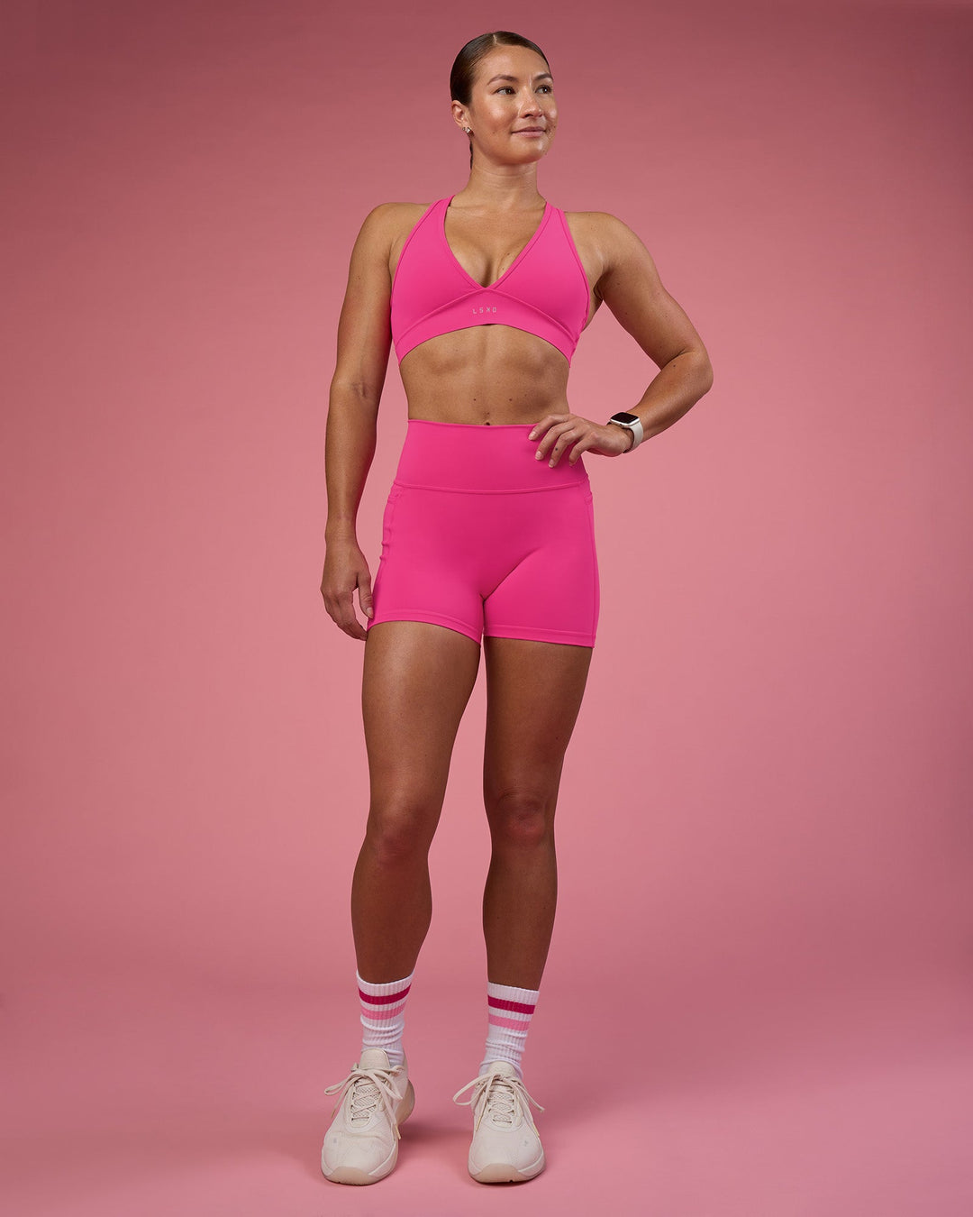 Woman wearing Stamina Rise Sports Bra - Ultra Pink | Model:Hannah | Size:S