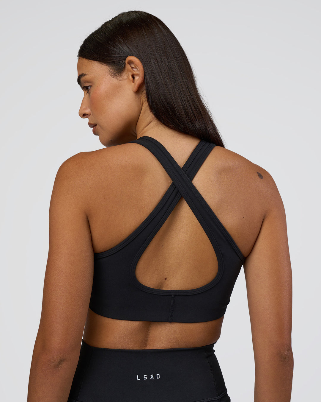 Woman wearing Stamina Sports Bra - Black | Model:Ruby | Size:S