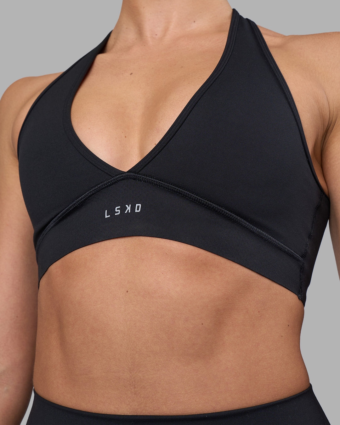 Woman wearing Stamina Sports Bra - Black | Model:Sophie | Size:S