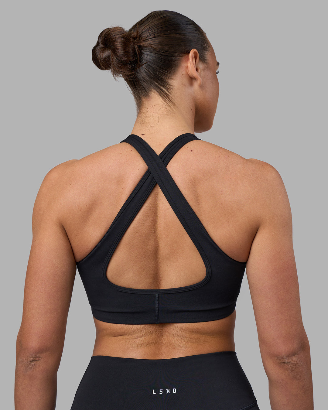 Woman wearing Stamina Sports Bra - Black | Model:Sophie | Size:S