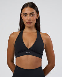 Woman wearing Stamina Sports Bra - Black | Set:true | Angle:front | Model:Ruby | Size:S | Thumbnail Index: 0