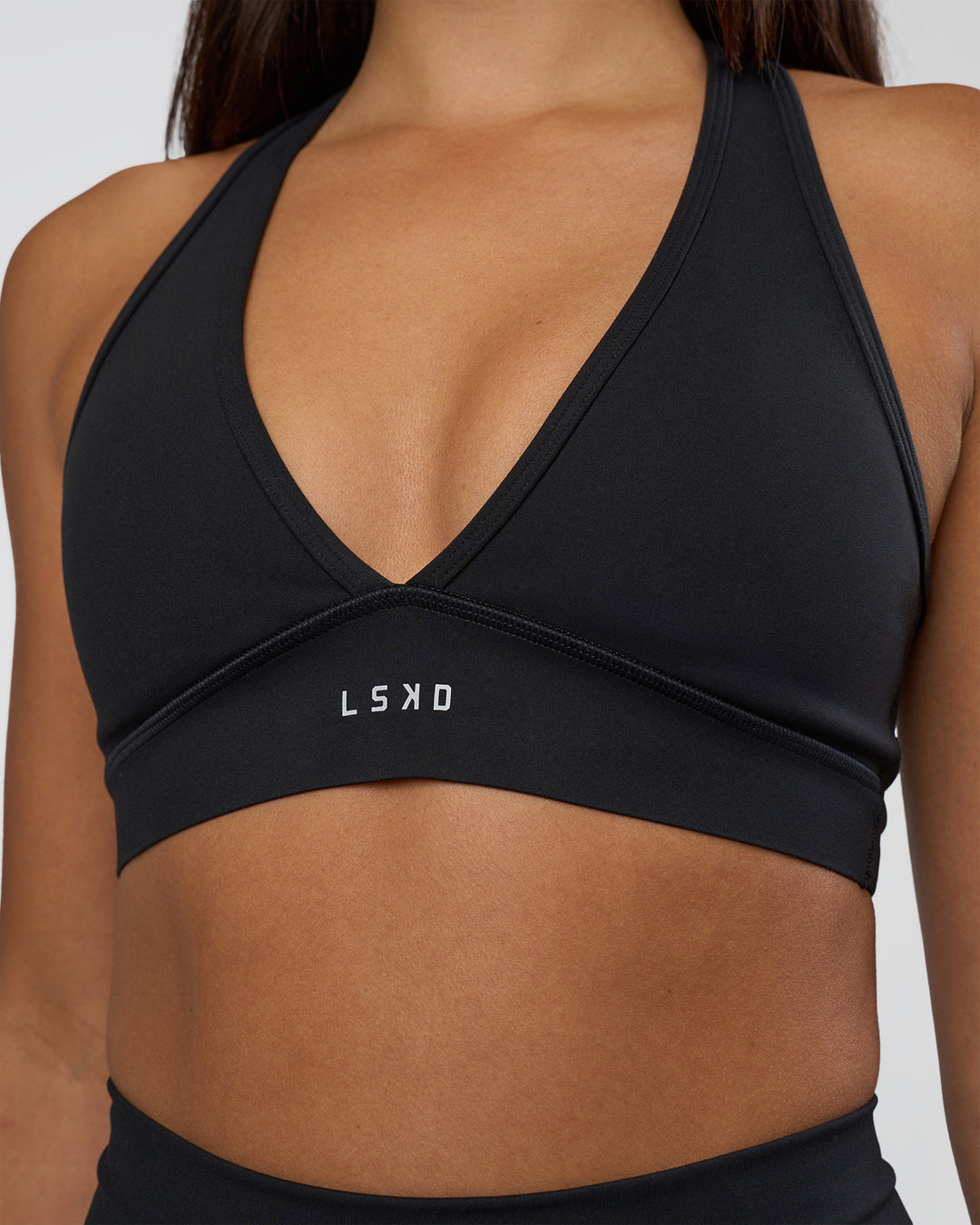 Woman wearing Stamina Sports Bra - Black | Model:Ruby | Size:S