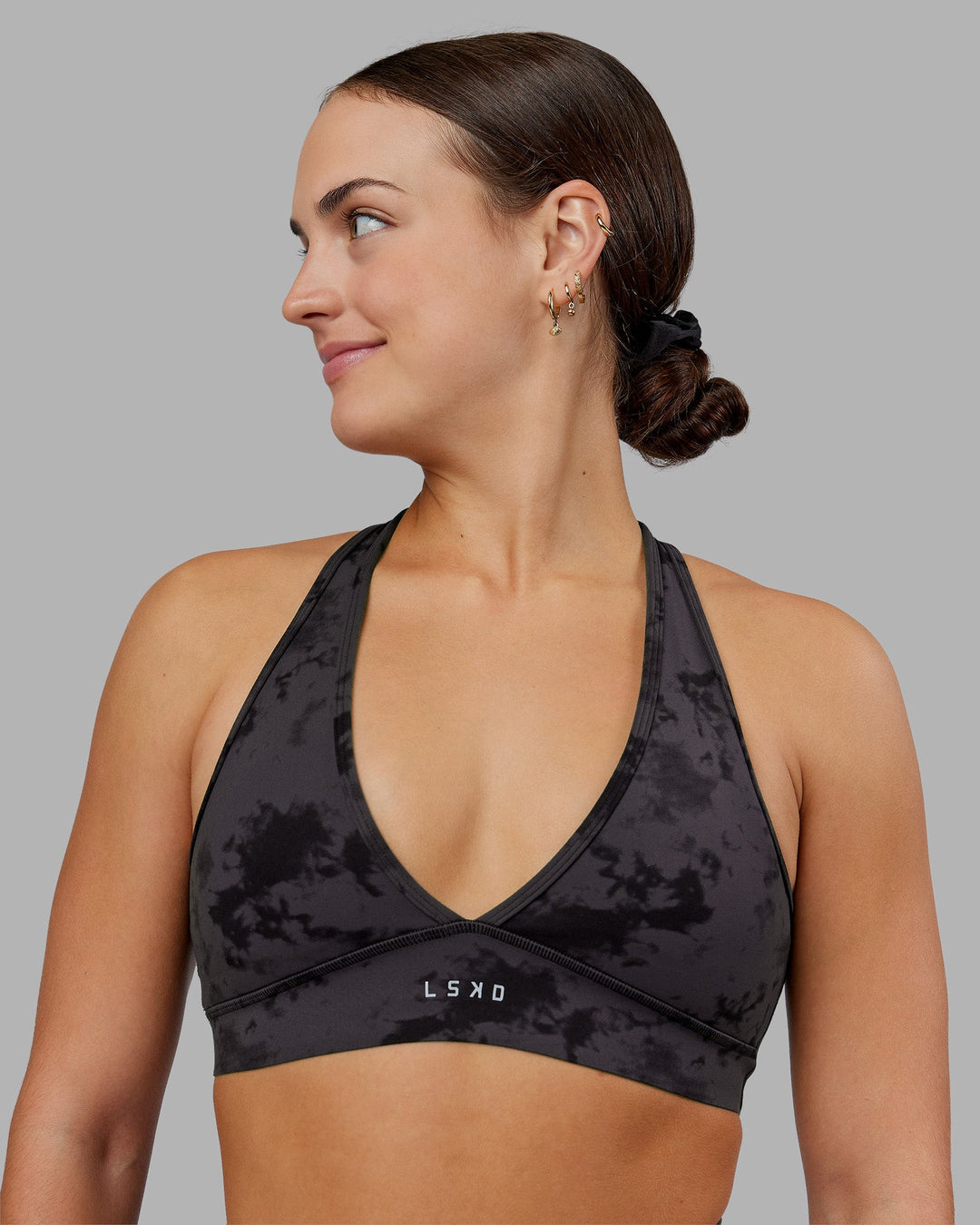 Woman wearing Stamina Sports Bra - Black Tie Dye | Model:Keisha | Size:S
