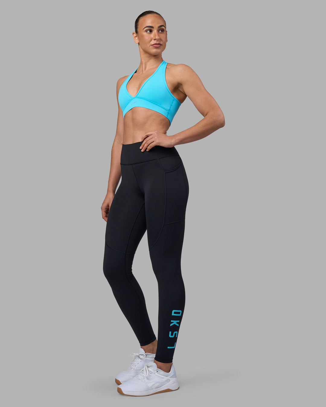 Woman wearing Stamina Sports Bra - Blue Atoll | Model:Sophie | Size:S