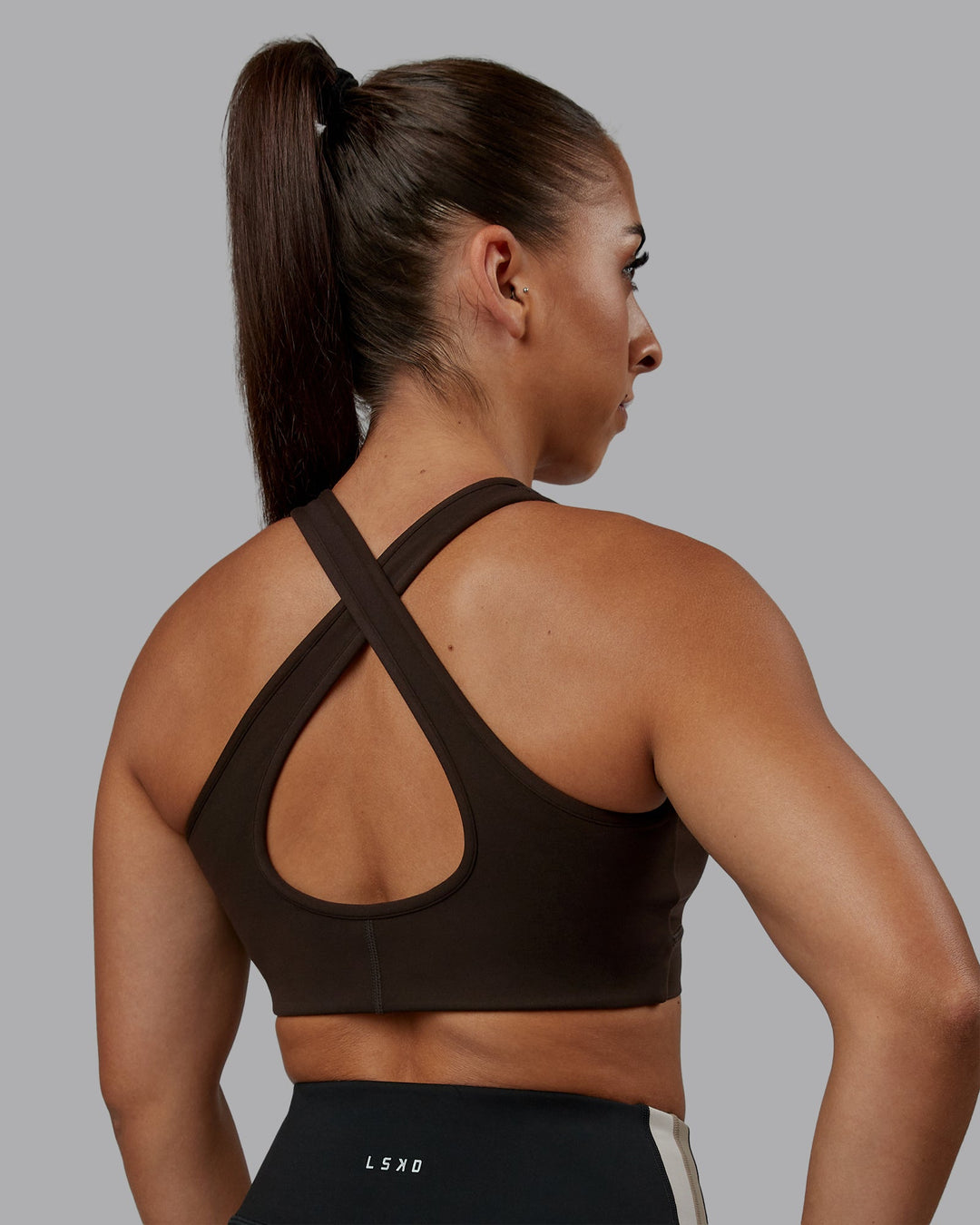 Woman wearing Stamina Sports Bra - Dark Walnut | Model:Tylah | Size:S