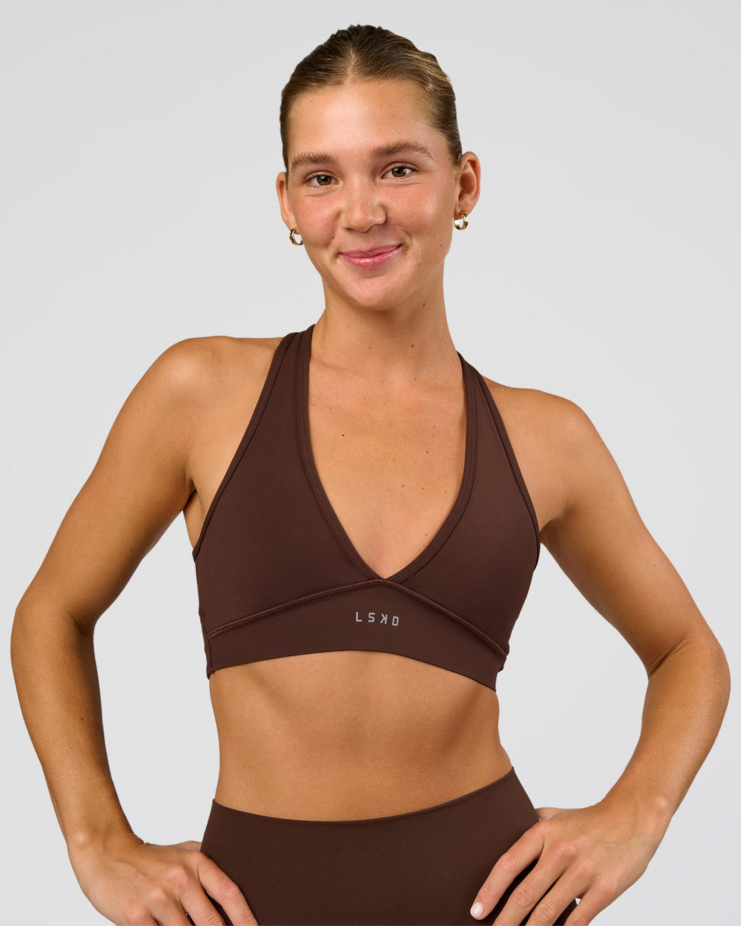 Woman wearing Stamina Sports Bra - Hot Chocolate | Set:true | Angle:front | Model:Amity | Size:S - view 2