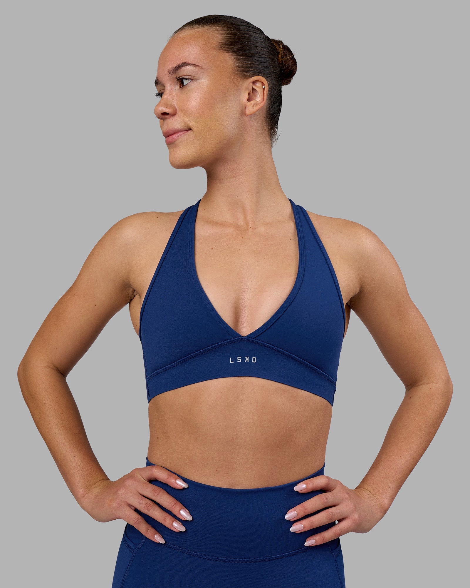 Woman wearing Stamina Sports Bra - Midnight Blue | Model:Charlize | Size:S