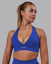 Woman wearing Stamina Sports Bra - Power Cobalt | Set:true | Angle:front | Model:Hannah | Size:S