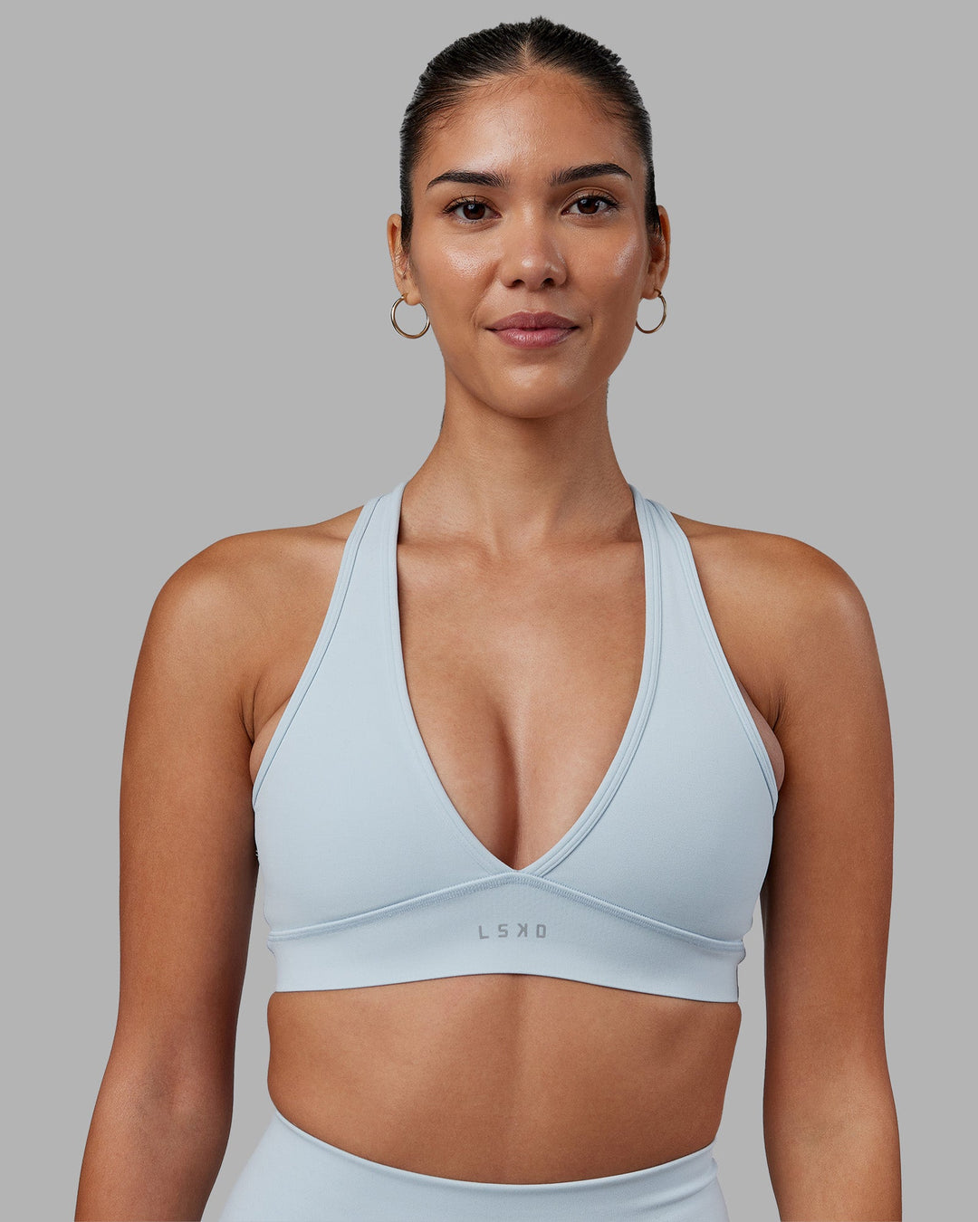 Woman wearing Stamina Sports Bra - Skyride | Model:Rhiley | Size:S