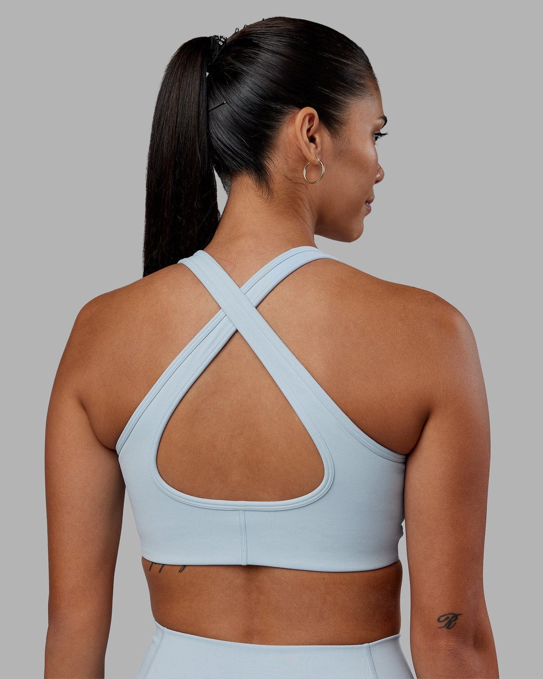 Woman wearing Stamina Sports Bra - Skyride | Model:Rhiley | Size:S