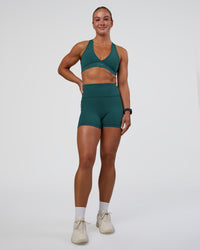 Woman wearing Stamina Sports Bra - Transformative Teal | Model:Sav | Size:S