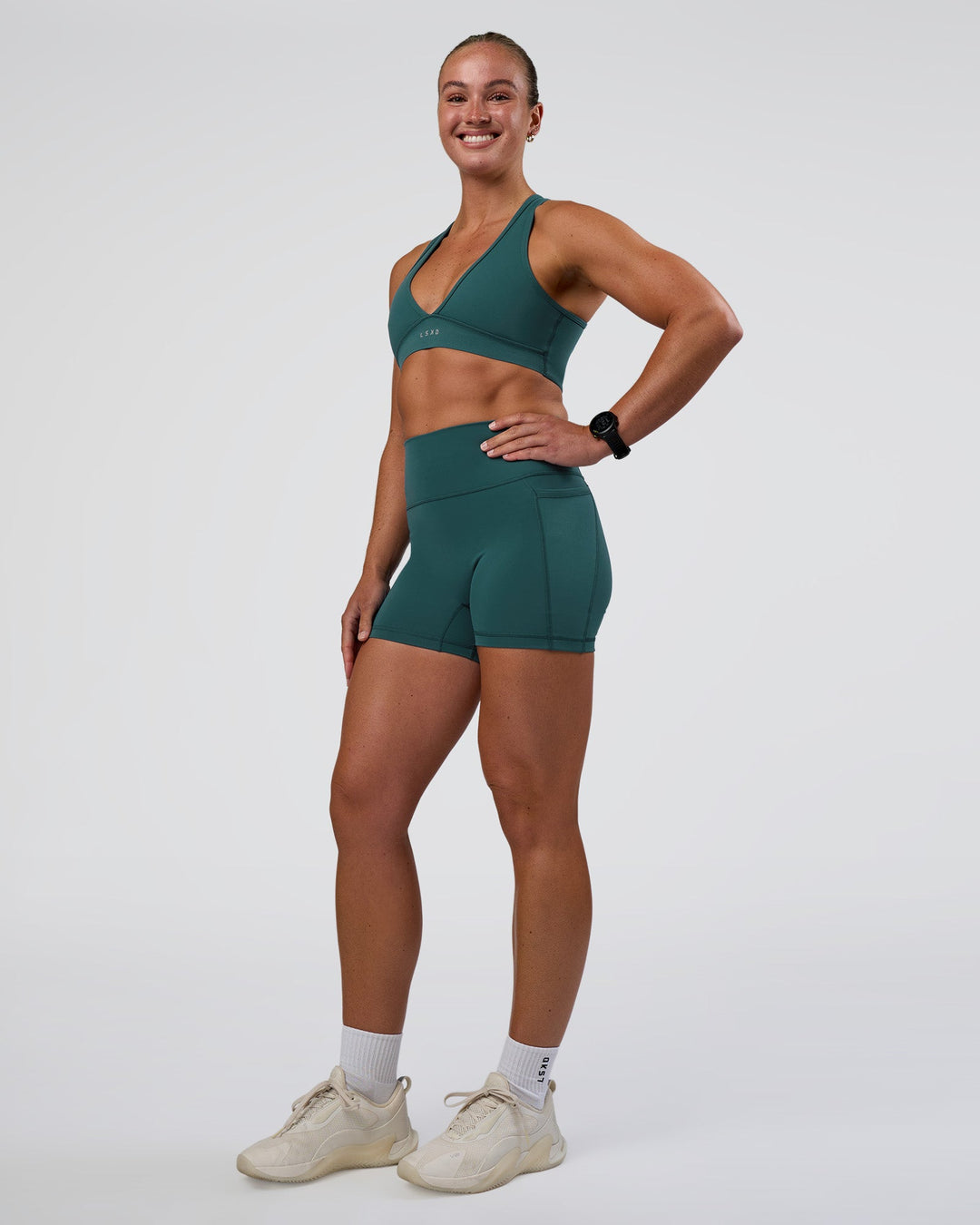 Woman wearing Stamina Sports Bra - Transformative Teal | Model:Sav | Size:S