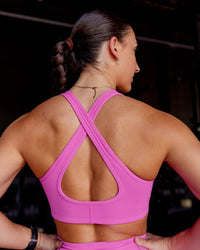 Woman wearing Stamina Sports Bra - Ultra Fuchsia | Model:Summer | Size:S