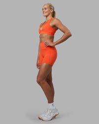 Woman wearing Stamina Sports Bra - Ultra Orange | Model:Katie | Size:S