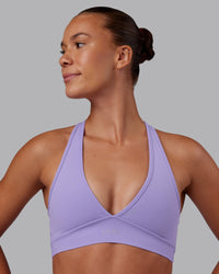 Woman wearing Stamina Sports Bra - Violet Ray | Set:true | Angle:front | Model:Charlize | Size:S | Thumbnail Index: 0