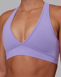Woman wearing Stamina Sports Bra - Violet Ray | Set:true | Angle:closeup | Model:Charlize | Size:S | Thumbnail Index: 3