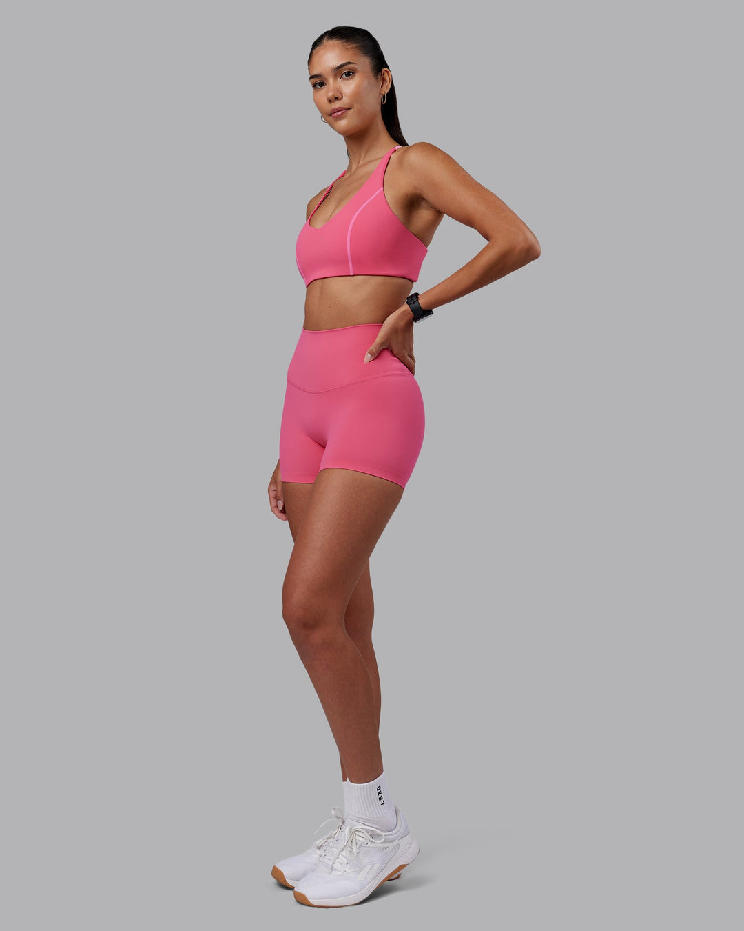 Woman wearing Stellar Sports Bra - Hot Pink | Model:Rhiley | Size:S