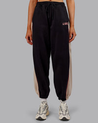 Woman wearing Stitch Up Fleece Sweat Pant - Black/Shale Beige | Model:Ella | Size:S | Thumbnail Index: 0
