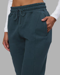 Woman wearing Stream Panel Track Pants - Deep Sea | Model:Rhiley | Size:S