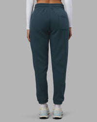 Woman wearing Stream Panel Track Pants - Deep Sea | Model:Rhiley | Size:S